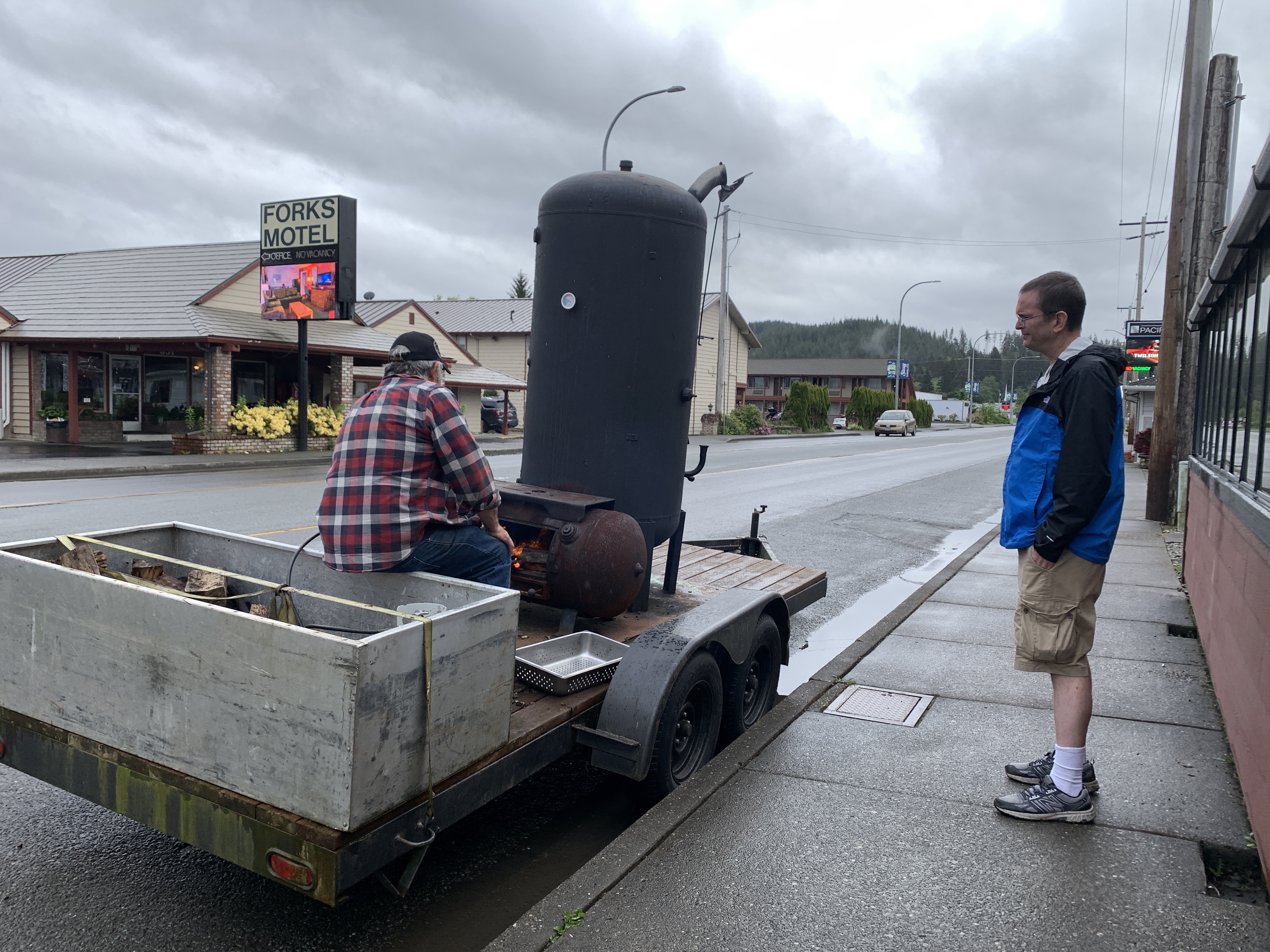 Erik chatting with local restaurant owner who made the smoker himself.